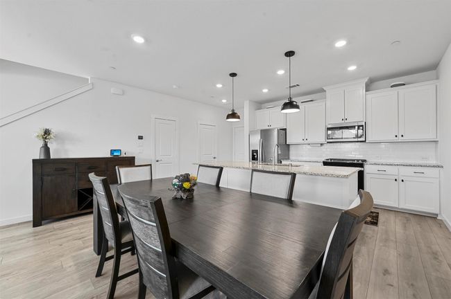 Dining area with sink and light hardwood / wood-style flooring | Image 8