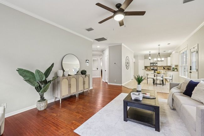A bright and airy living room perfect for both quiet mornings and vibrant entertaining. | Image 12