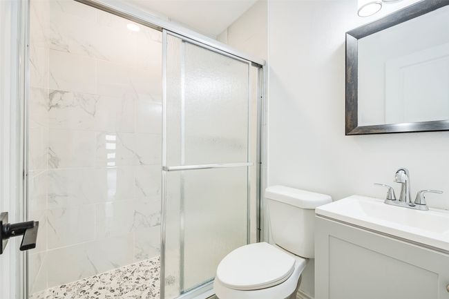 Full bathroom with a shower stall and vanity | Image 20