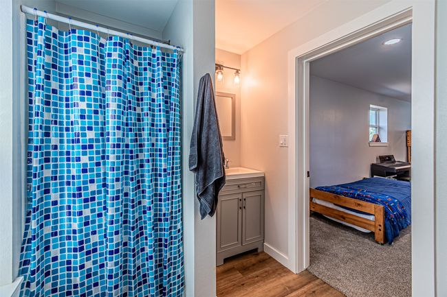 Bathroom with wood finished floors, vanity, and connected bathroom | Image 30