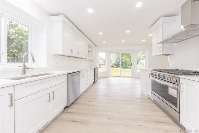 Breathtaking wide open kitchen with a fountain pond view | Image 10