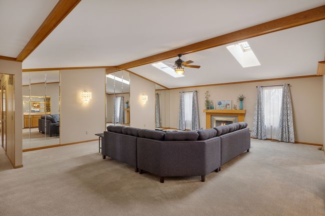 Beamed ceiling and mirrored accent wall | Image 11