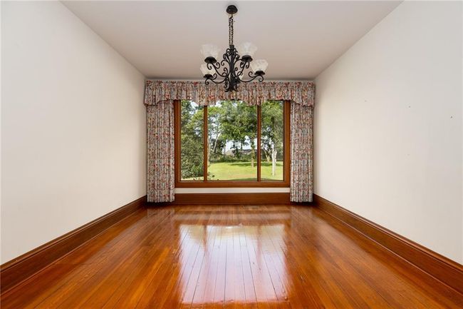 Unfurnished room featuring hardwood / wood-style flooring and a chandelier | Image 10
