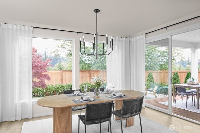 Dining Room with elegant chandelier and access to the Signature Outdoor Room. Facade, Ext Colors, Interior Photos & Floor Plans for illustrative purposes only. Actual Facade, Ext Colors, Interiors & Floor Plans may differ. | Image 7