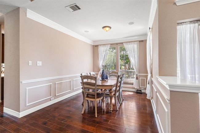Formal dining room located right next to the foyer. | Image 5