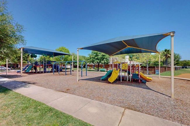 Community jungle gym. There is also a fishing pond next door . | Image 37