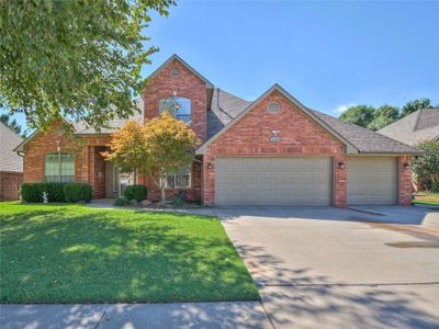 View of front property featuring a garage and a front yard | Image 1