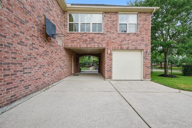 In addition to the garages, you will have an extra covered parking space to protect your car from the Texas heat. | Image 45