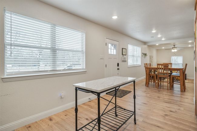 Dining room with ceiling fan and light hardwood / wood-style floors | Image 14