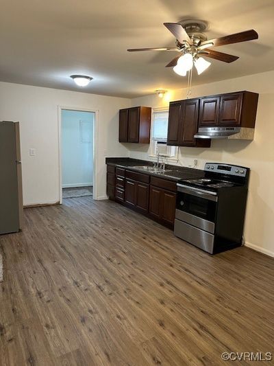 Large open kitchen open to laundry/mud room | Image 3