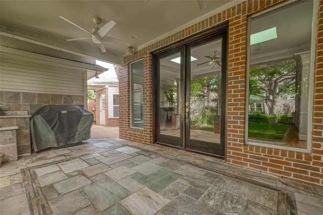 COVERED PATIO with Fan. Grill stays. | Image 42