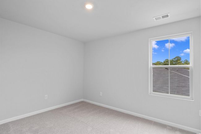 Unfurnished bedroom featuring baseboards and carpet flooring | Image 13