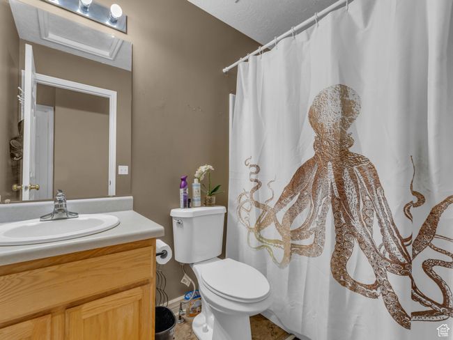 Full bath with vanity, toilet, baseboards, and a shower with shower curtain | Image 29