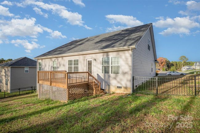 Back View of the Home and gated steel fence with key lock | Image 33