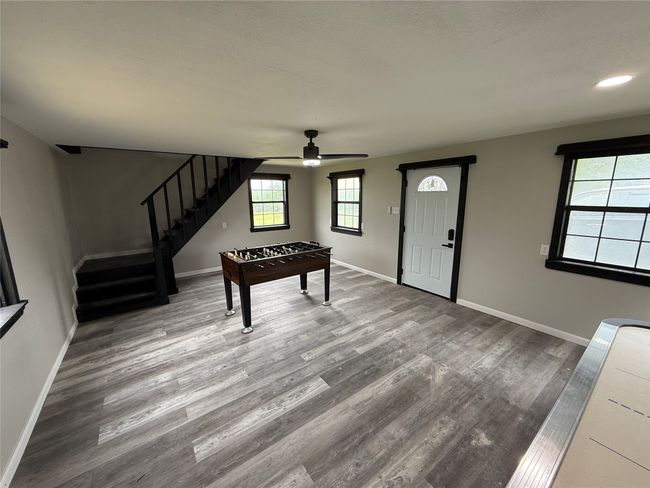 Playroom with wood finished floors and ceiling fan | Image 32