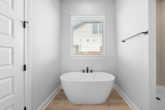 Relax in the large soaking tub or enjoy the spacious, standing shower. | Image 7