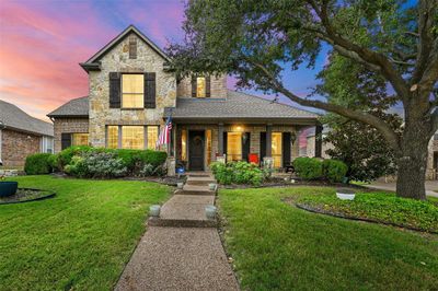 View of front of house with a yard and covered porch | Image 1