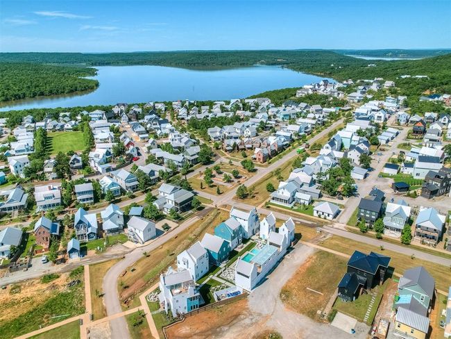 Aerial view of property and surrounding area with a large body of water and nearby suburban area | Image 47