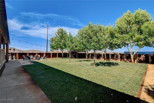 Fenced backyard featuring a patio area | Image 42