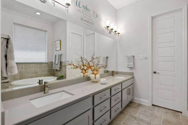 The long dual vanity provides ample storage space. | Image 22