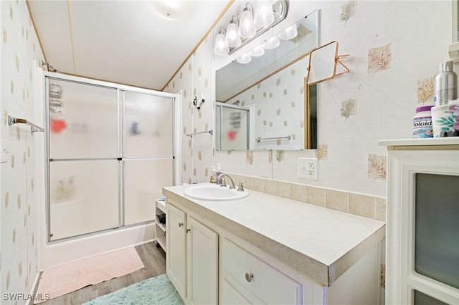 Primary bath with LVT flooring. | Image 13