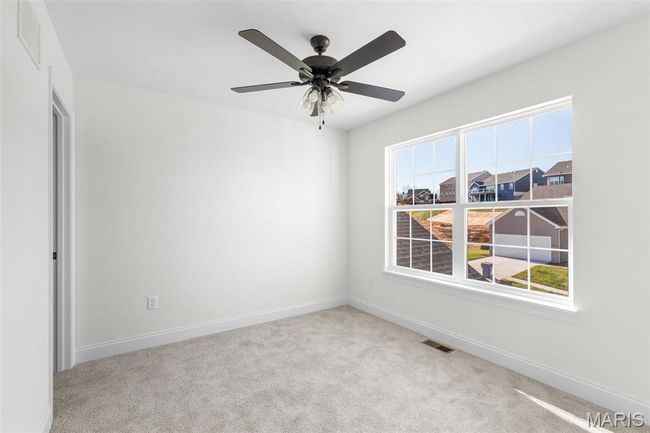 Empty room with carpet flooring and ceiling fan | Image 13