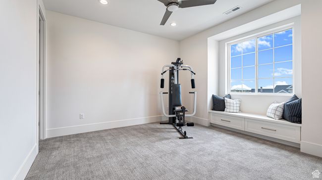Exercise room featuring recessed lighting, visible vents, light colored carpet, and ceiling fan | Image 50