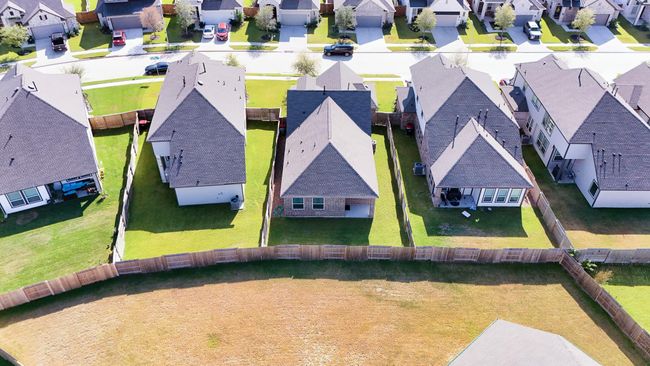 A peaceful aerial view of this beautifully maintained home showcases pride of ownership and thoughtfully designed homes throughout the Marvida community. | Image 29