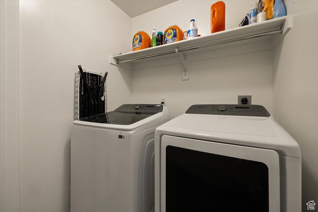 Washroom featuring washing machine and dryer and laundry area | Image 17