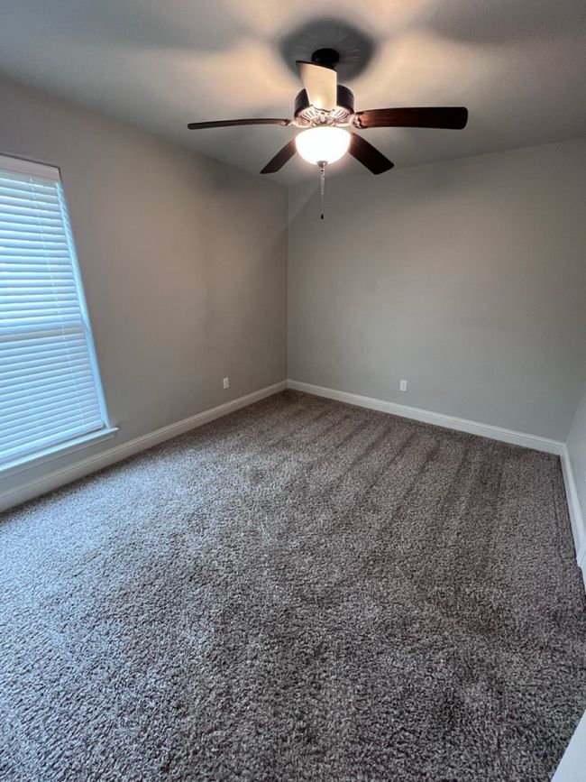 Spare room featuring a ceiling fan, baseboards, and carpet | Image 35