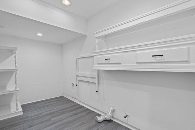 Laundry and mud room connect the garage to the kitchen. This space has been taken from the second bay of the garage, leaving the garage door intact and storage as well. | Image 29