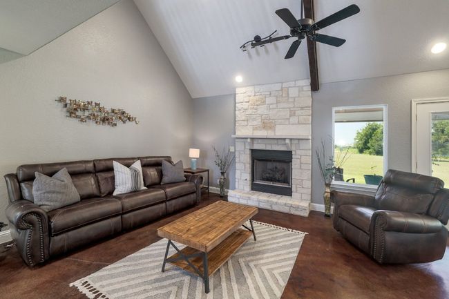 Cozy wood-burning fireplace. | Image 7