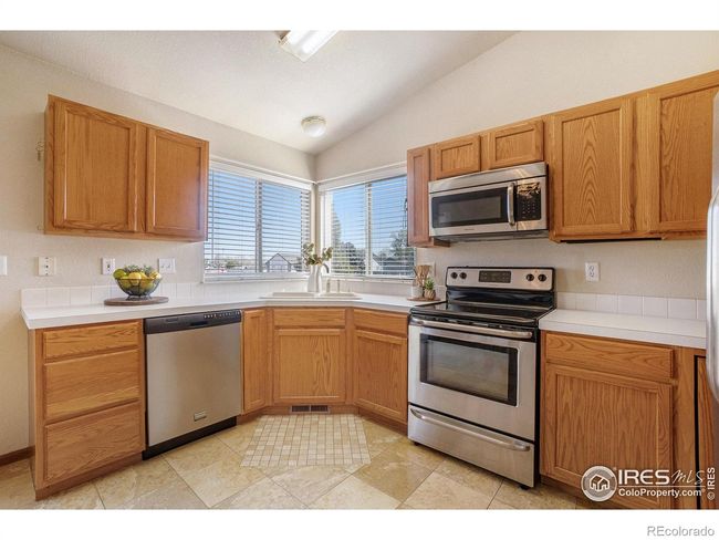 Kitchen looks to huge back yard | Image 10