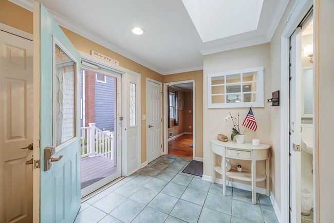 Doorway with ornamental molding, recessed lighting, light tile patterned floors, and a healthy amount of sunlight | Image 17