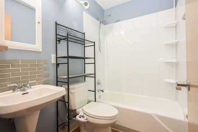 Full bathroom with storage. | Image 16