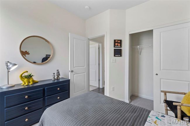 Bedroom featuring a closet, carpet flooring, and baseboards | Image 8