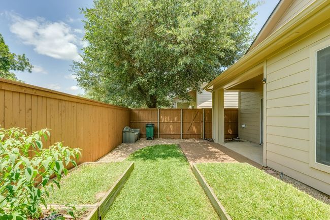 Fenced backyard featuring a patio area | Image 33