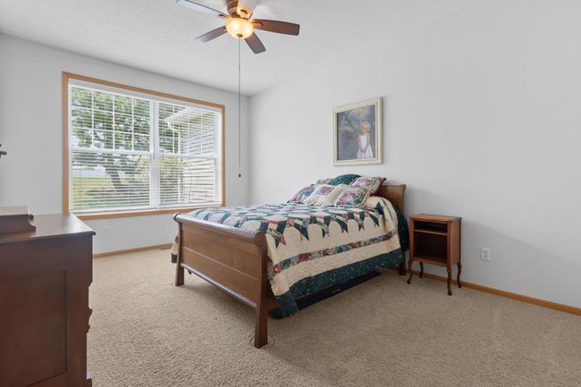 Spacious primary bedroom with west-facing windows. | Image 12