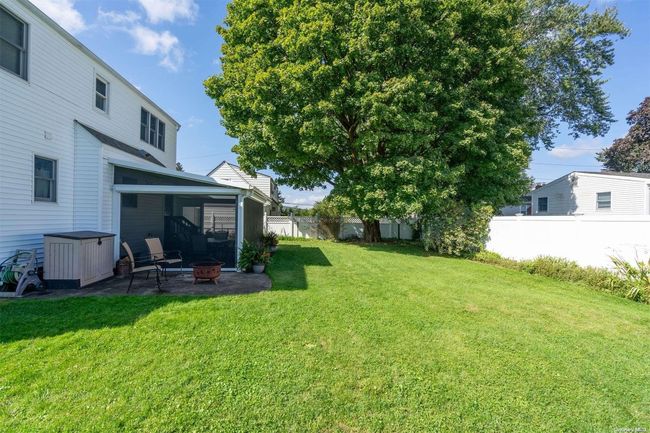 Back yard looking at house with Life Room screens DOWN | Image 24