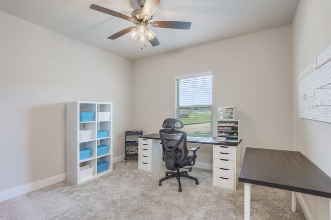 Currently used as a craft room, this spacious bedroom offers many possibilities. | Image 20