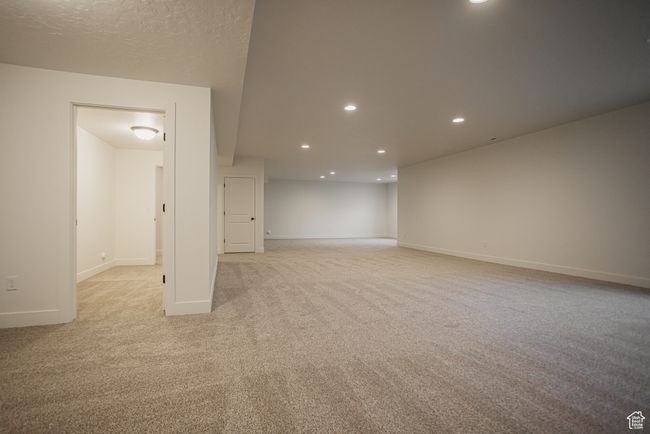 Carpeted empty room featuring a textured ceiling | Image 27