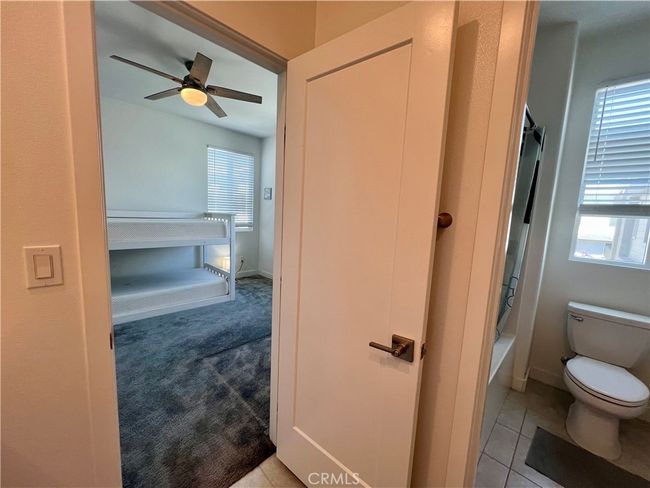 View of the 4th bedroom from its Jack and Jill bathroom. | Image 25
