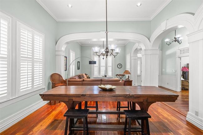A formal dining room with high ceilings and crown moldings.... just right for candlelight. | Image 9