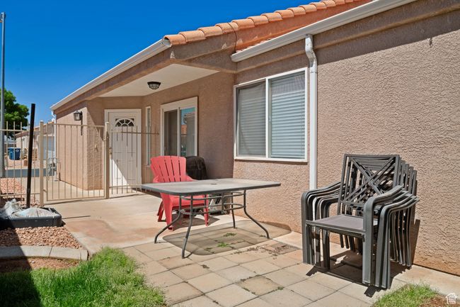 View of patio with a gate and fence | Image 19
