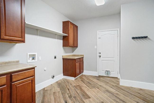 Large laundry center with plenty of storage | Image 15