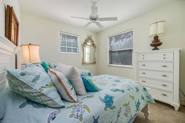 Bedroom featuring carpet and ceiling fan | Image 16