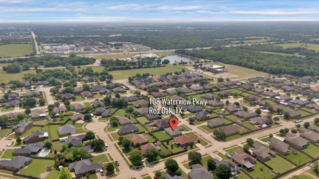View of property location featuring a large body of water and nearby suburban area | Image 6