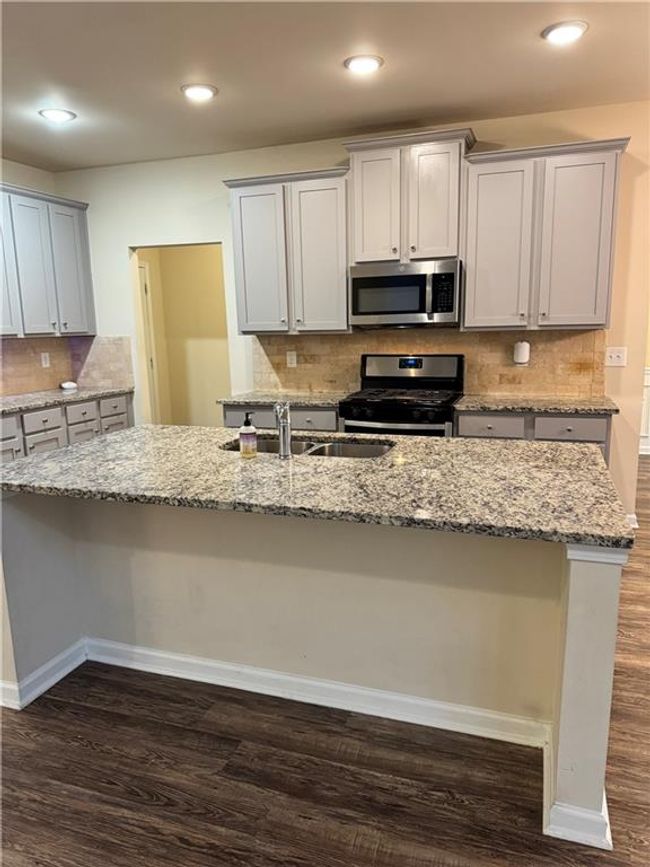 7703 Hansel Ln, House other with 4 bedrooms, 3 bathrooms and null parking in Lithonia GA | Image 7