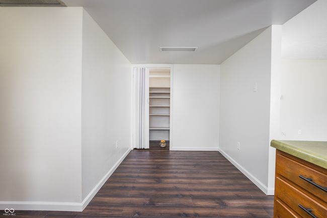 unfurnished dining area with dark wood finished floors pantry | Image 30