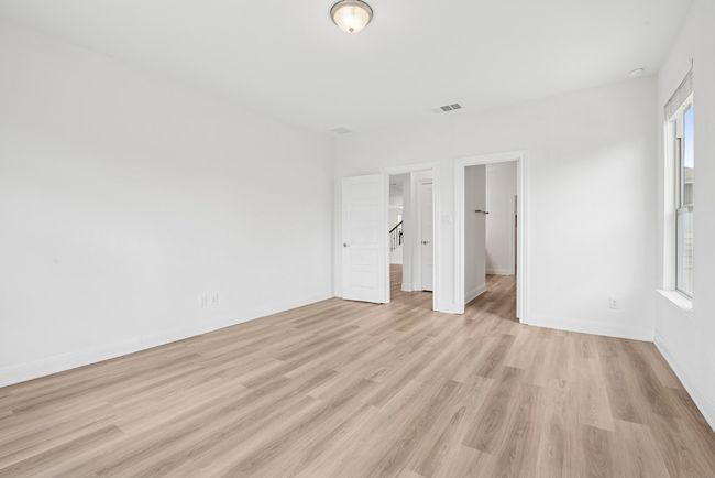 Expansive primary bedroom with ensuite bathroom. | Image 11